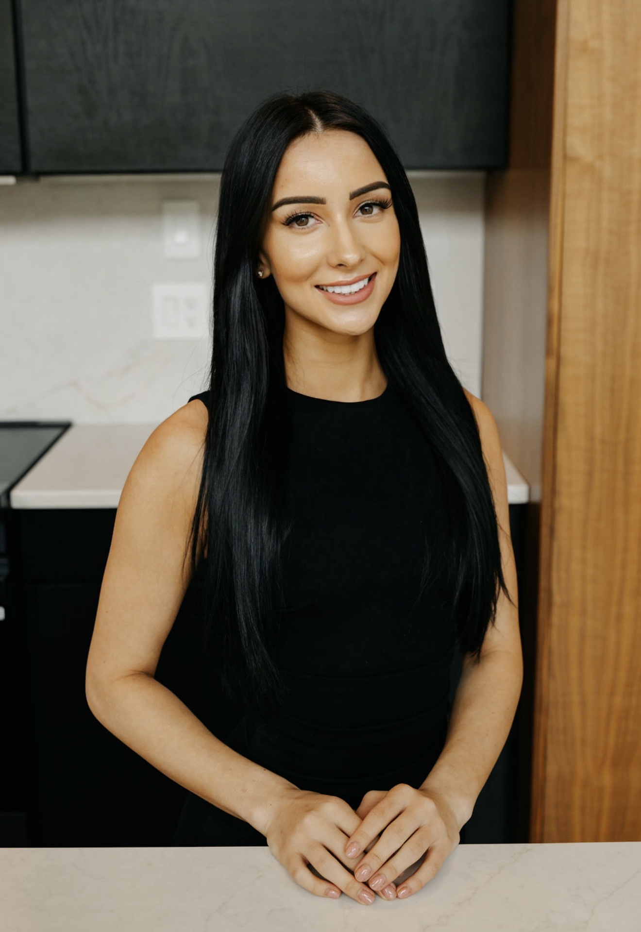 Magdalena smiling in her studio kitchen
